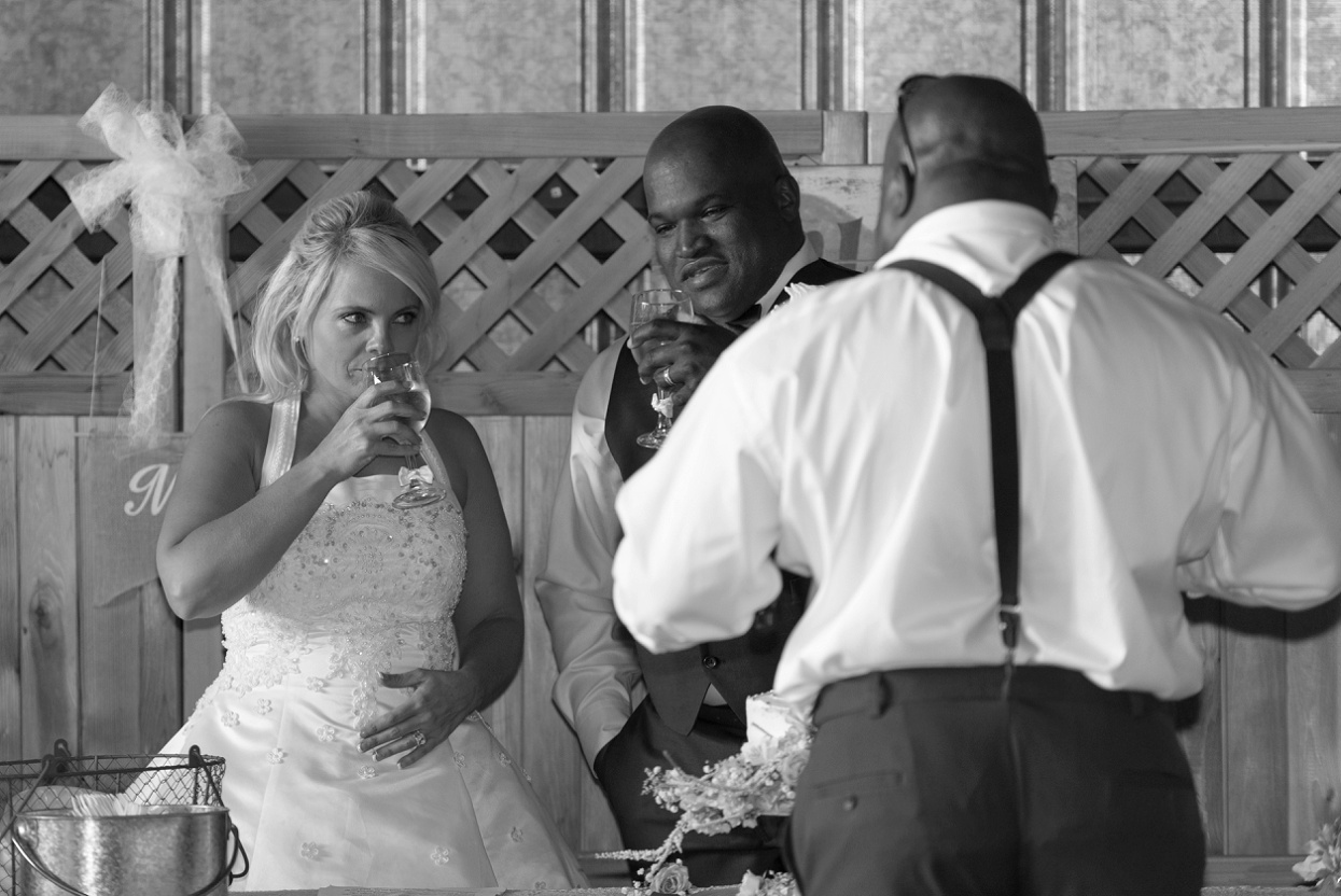 Bride and groom drinking champagne