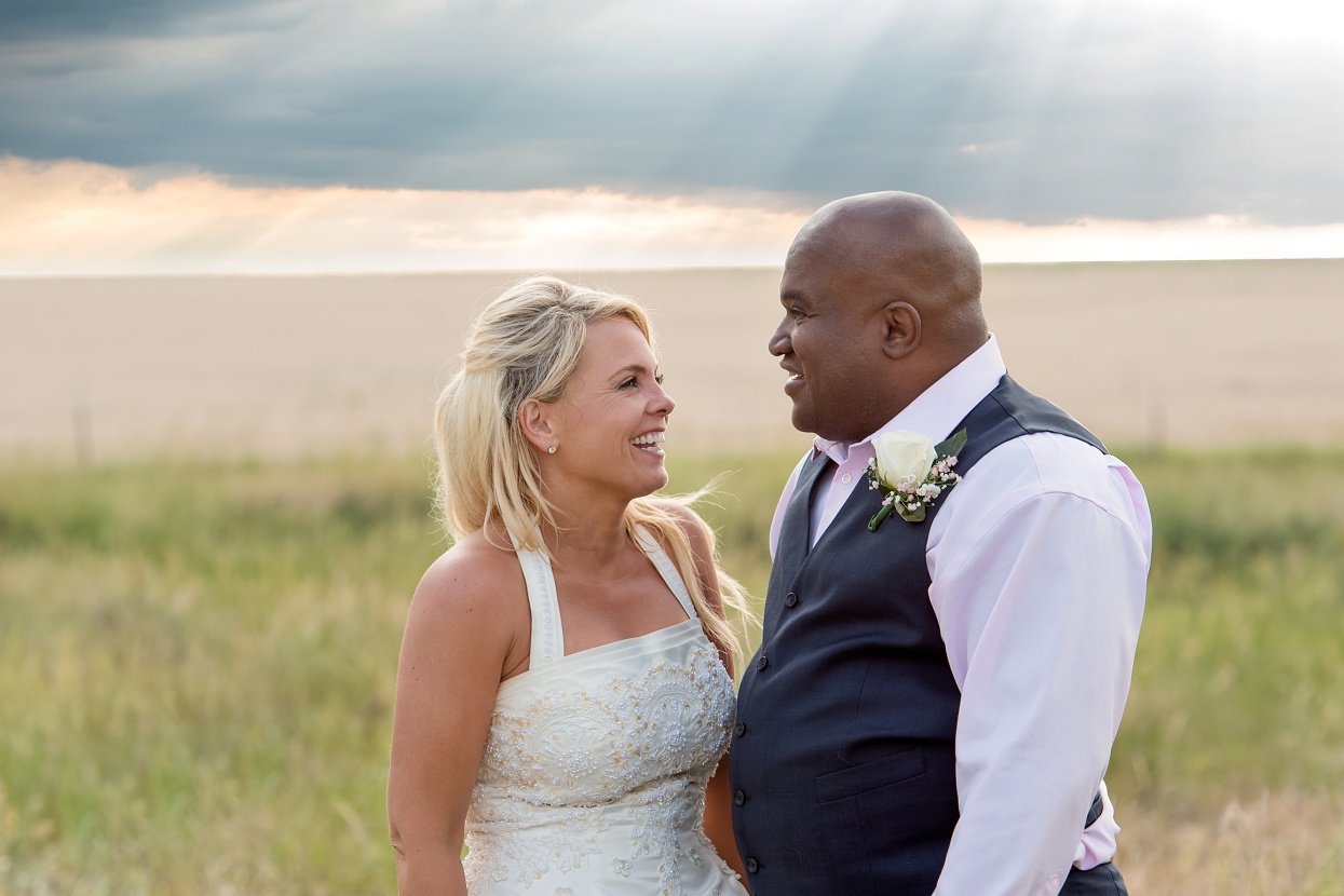 Bride and groom sunset photos with rays of god