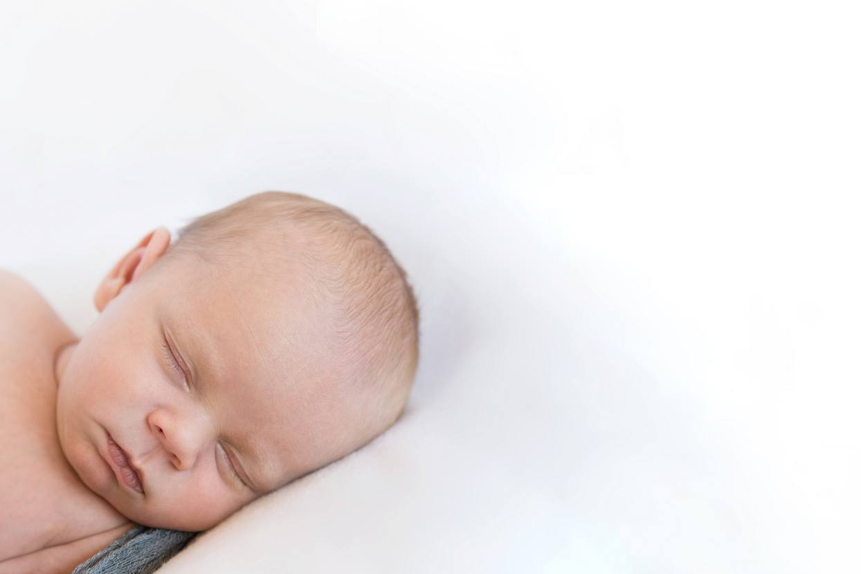 Denver newborn photos, diagonal crop, white background