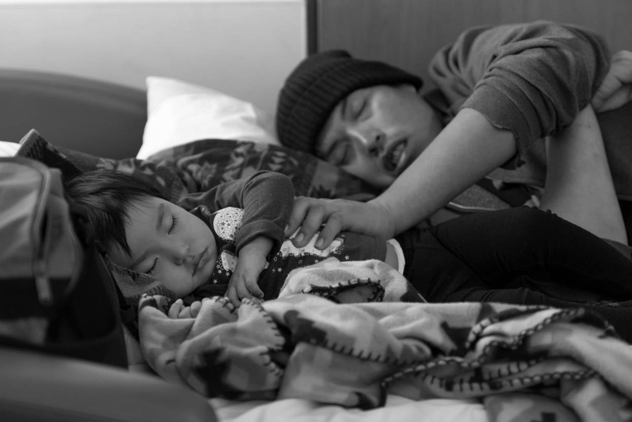 Father and daughter sleeping, waiting for birth at Denver Health